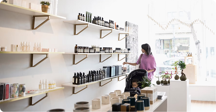 Merchant browsing shelves in a retail store